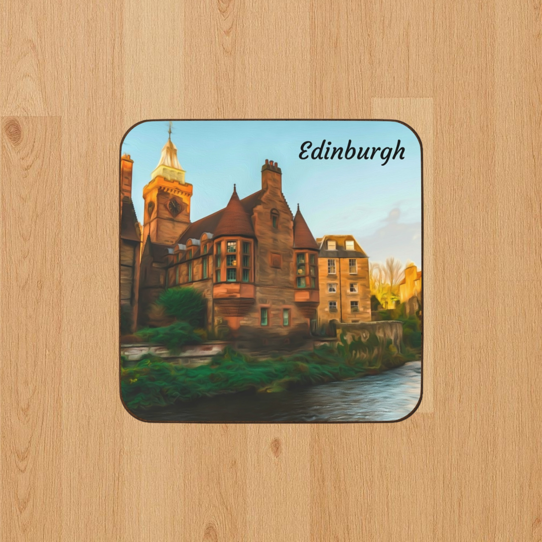 Square hardboard coaster featuring a watercolor of Dean Village, Edinburgh — amber sandstone buildings beside the Water of Leith in warm golden afternoon light. The Painted Passport Original Series.