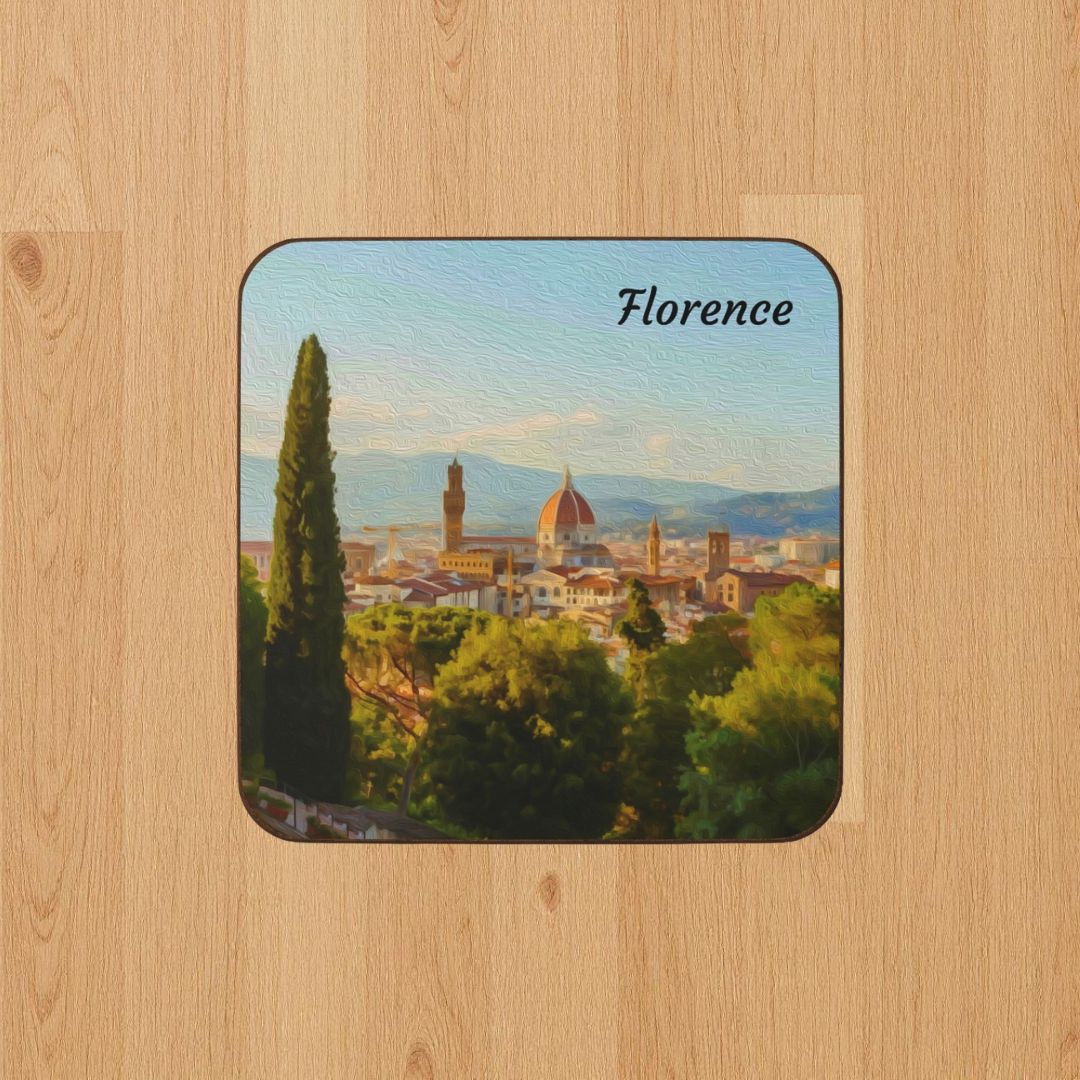 Square hardboard coaster featuring a watercolor of Florence from Piazzale Michelangelo — Brunelleschi's dome and the Palazzo Vecchio tower rising above the city in warm Tuscan light. The Painted Passport Original Series.